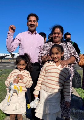 The Nadesalingam family: Tharnicaa, Nades, Priya, and Kopika.