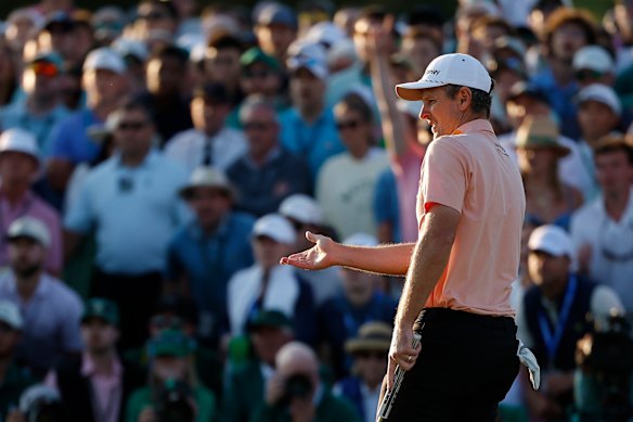 Justin Rose of England reacts to missing his putt on the 18th green. 