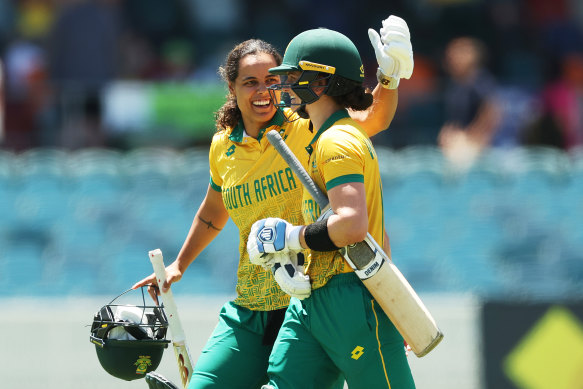 Chloe Tryon and Laura Wolvaardt of South Africa celebrate after the win.