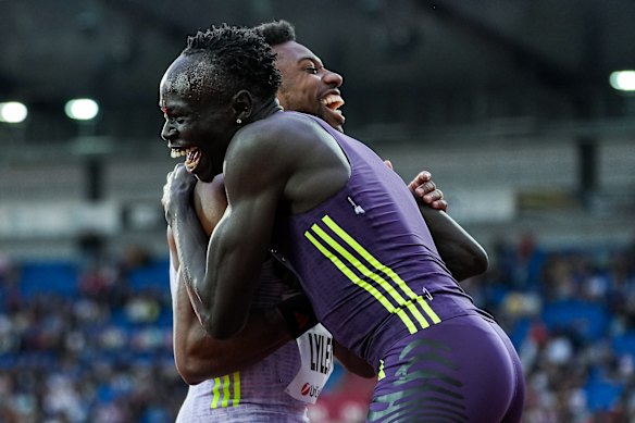 Noah Lyles and Gout Gout embrace after Lyles’ record-breaking run.