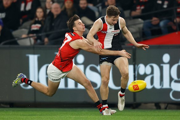 Jack Billings is tackled by Nic Martin.