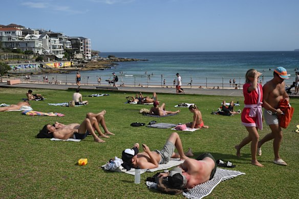 Bondi began to be reclaimed by sunbathers four days on from the attack.