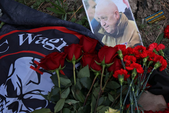 A portrait of Wagner chief Yevgeny Prigozhin left at a makeshift memorial near former PMC Wagner Centre in Saint Petersburg, Russia.