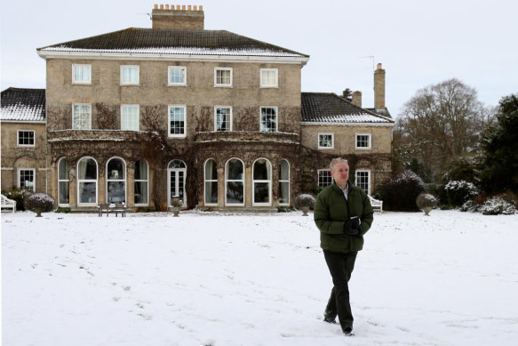 WikiLeaks founder Julian Assange walks across the lawn at Ellingham Hall in Norfolk.