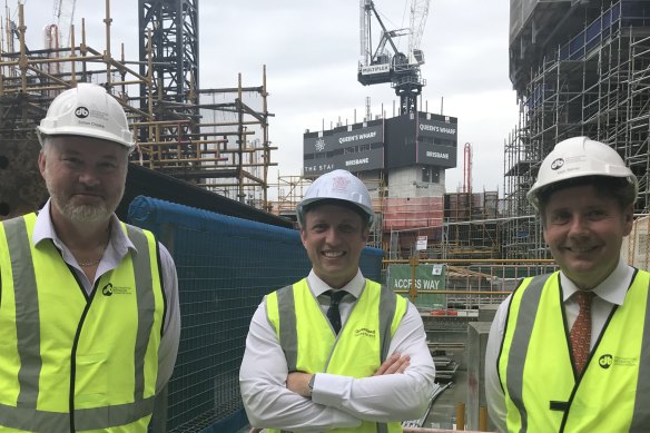 Planning Minister Steven Miles (centre) facing community pressure for review of protections for Brisbane’s character housing. Here with  Destination Brisbane project director Simon Crooks and Star CEO Matt Bekier 