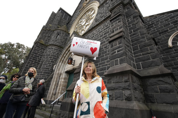 Protesters outside the Saints Peter and Paul’s Catholic Church on Saturday.