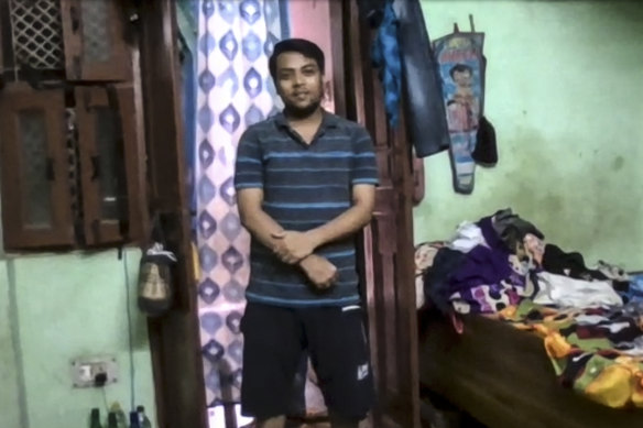 Tushar Joshi inside his family home in a Delhi slum. He is studying a master of international relations remotely at the University of Sydney.