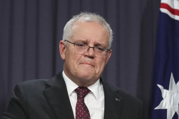 A visibly distressed Prime Minister Scott Morrison at a press conference in Canberra on Tuesday.