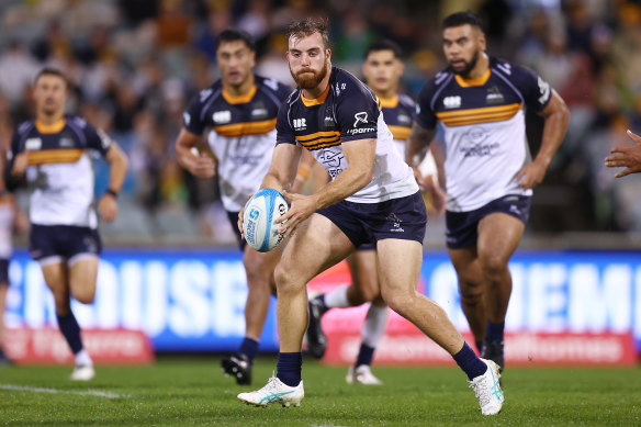 Hudson Creighton of the Brumbies looking for space in Canberra