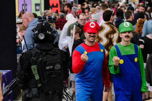 John, 50, and Matthew, 16, dressed as Super Mario Brothers at Supanova  on Sunday.