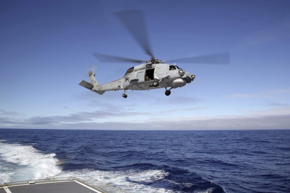 A Royal Australian Navy Seahawk helicopter had a near miss with a Chinese fighter jet.