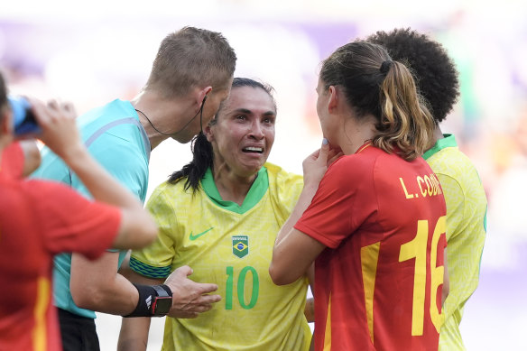 Marta becomes emotional after being sent off in Brazil’s game against Spain.