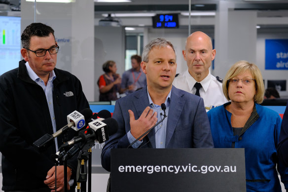 Andrew Crisp, with Daniel Andrews, Brett Sutton and Lisa Neville.