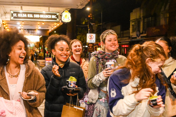 Young patrons enjoying Acland Street’s night-time vibe on Thursday.