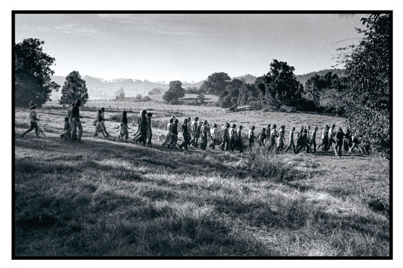 Festival leader Paul Joseph strolled through the campsite every morning, singing a song by the Incredible String Band, as followers in a conga line chanted the lyrics: May the long time sun shine upon you, All love surround you, And the pure light within you, Guide your way home.