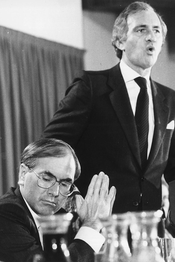 Andrew Peacock launches his economic policy at the National Press Club in 1984 while John Howard listens. 