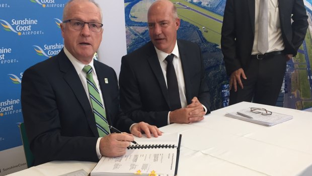 Sunshine Coast mayor Mark Jamieson (left) signs the agreement for developer Palisade to operate the airport.