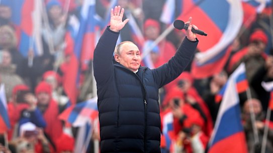 Russian President Vladimir Putin appears at a pro-war rally in Moscow.