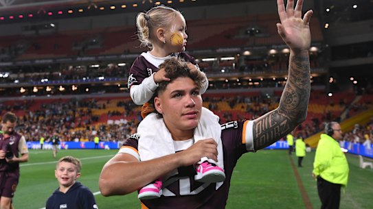 Reece Walsh celebrates Saturday night’s Preliminary Final win with his daughter, Leila.