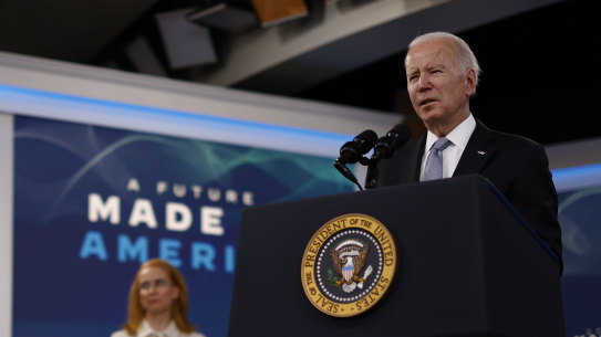 Joe Biden speaks on American manufacturing in Washington alongside Tritium chief executive Jane Hunter.