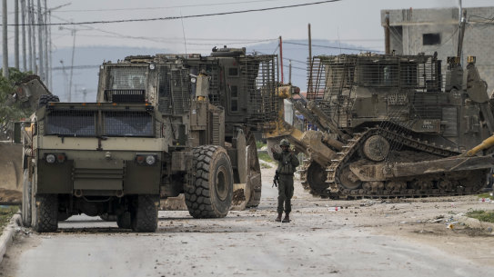 Israeli army vehicles are seen during a military operation in the West Bank city of Jenin.