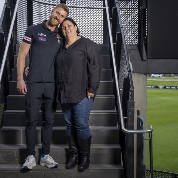Essendon skipper Dyson Heppell with Bobbie Lee Blay, a constant presence throughout his footy career.