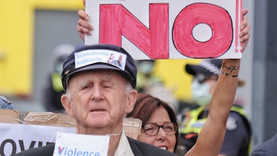 Police are seen guarding the office of Greg Hunt ,Federal Health Minister, during an-Anti vaccine rally, in Somerville on Saturday 27 February 2021. Photo Luis Enrique Ascui 