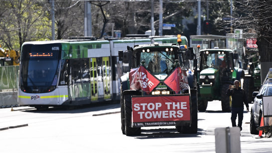 Farming families from the western district gather at the steps of the Victorian parliament.