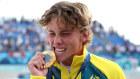 Keegan Palmer with his skateboard gold medal.