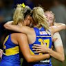 Teammates hug Dana Hooker after the loss to Carlton.