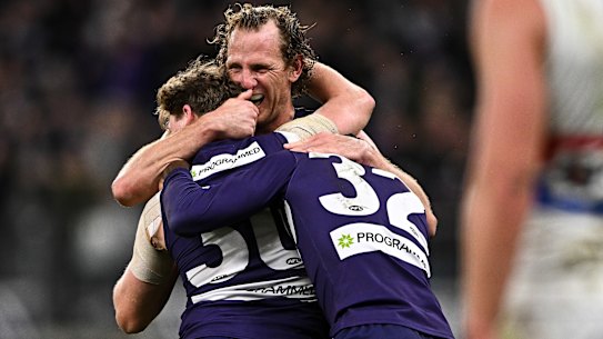 Nathan O’Driscoll, David Mundy and Michael Frederick celebrate.
