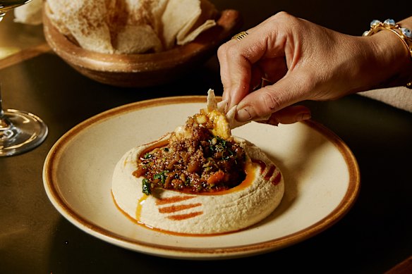 Tom Sarafian's famous hummus topped with spanner crab and prawns at Zareh.
