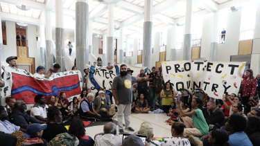 Protestors against fracking in the marble foyer of Parliament House in Canberra.