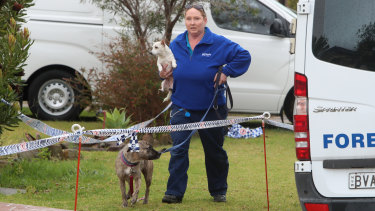 Dogs in the care of victim Kristie Powell were removed from the home on Friday morning. 
