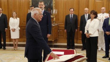 Josep Borrell at his swearing in ceremony at the Zarzuela Palace in Madrid in June. King Felipe VI is immediately behind him.