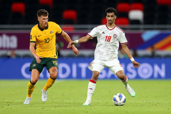 Winning goal scorer Ajdin Hrustic is challenged by Abdullah Ramadan of United Arab Emirates.