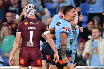 Latrell Mitchell celebrates Jack Wightonâs try on Wednesday night.