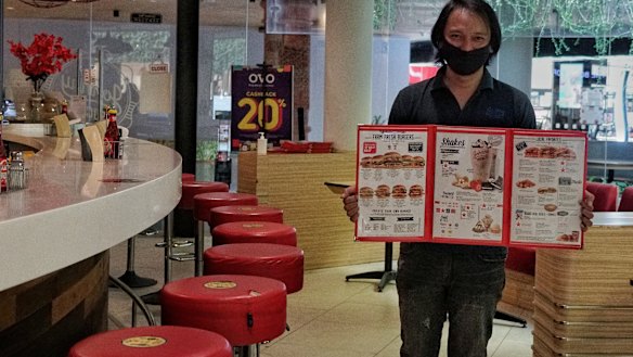 Rizky Nuari, the regional manager for Johnny Rockets chain restaurant, was ready to welcome customers for Bali's July 31 re-opening to domestic tourists.