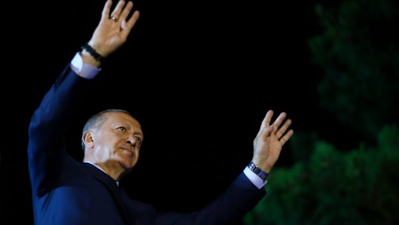 Erdogan addresses supporters outside his official residence in Istanbul.