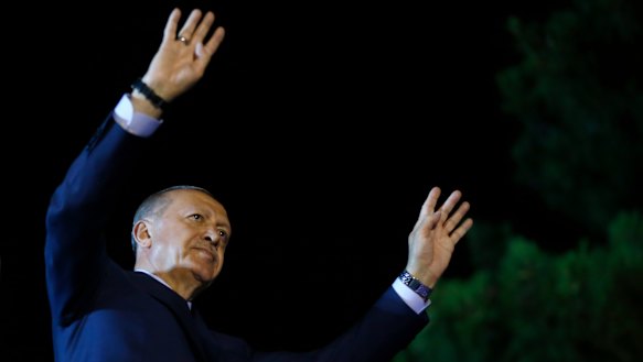 Erdogan addresses supporters outside his official residence in Istanbul.