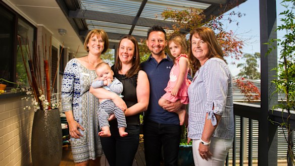 Midwife Ann Clark, Susie Shadmaan with Leo, 4 months, Obi Shadmaan with Eva, 2, and midwife Chrissie Foy. 