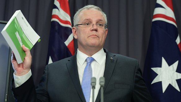 The Treasurer explains his new GST system at a press conference in Canberra.
