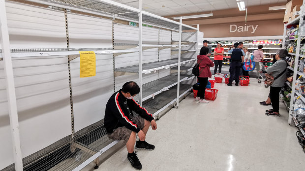 Shoppers wait for toilet paper at Coles in Epping on March 20.