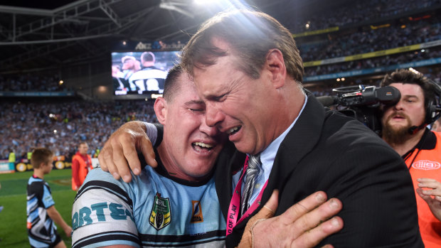 'We did it': Paul Gallen and Andrew Ettingshausen embrace after the Sharks' maiden grand final win in 2016.