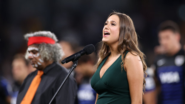 Olivia Fox sings the national anthem at Bankwest Stadium on Saturday evening. 