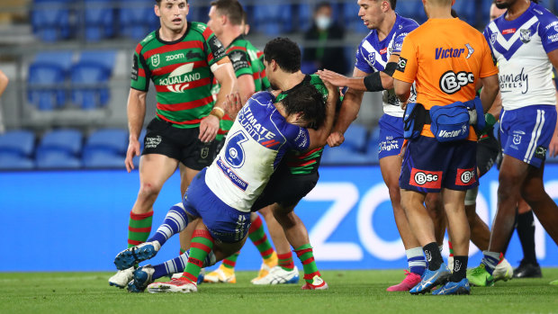 Lachlan Lewis tackles Cody Walker after the half-time siren.