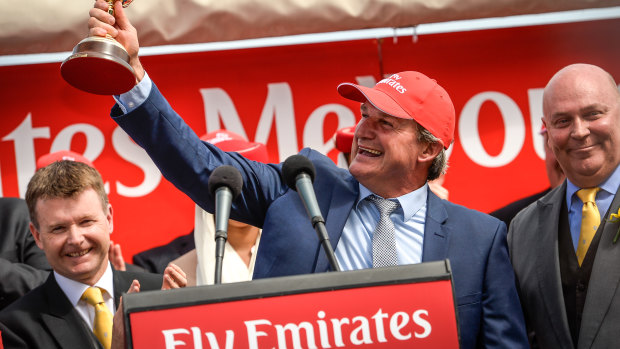 Darren Weir, pictured after Prince of Penzance's Melbourne Cup win, was arrested on Wednesday, opening the way for other thoroughbred trainers to swoop on his clients.