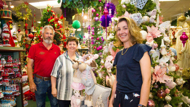 Christmas Barn owners Neville and Leanne de Smet with daughter Carly, who is also part of the business.