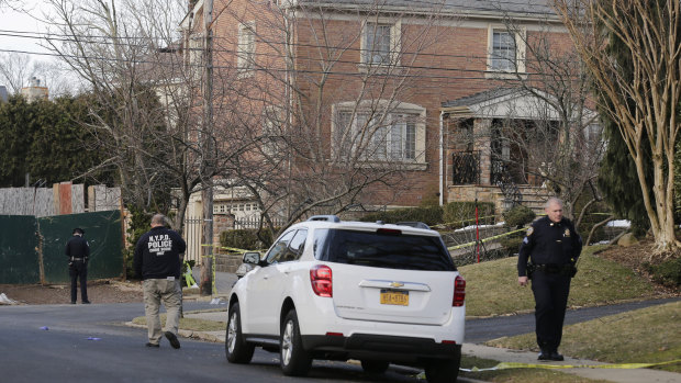 Police work near the scene in Staten Island where Cali was gunned down. 