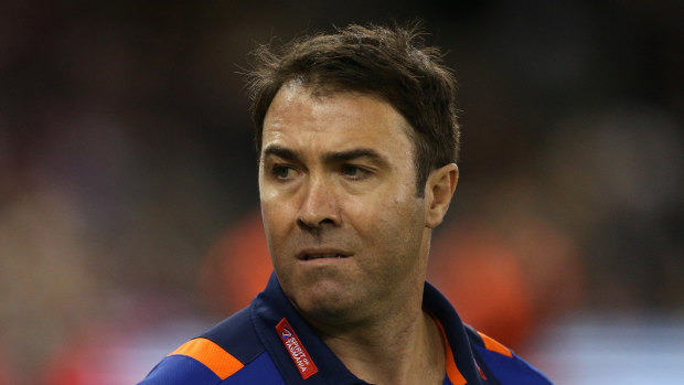 Terse response: North Melbourne coach Brad Scott threatens to ring in the changes after third loss in three games.